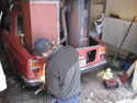 Micke is cutting holes in the rear of the car to make it possible to take out ashes from the generator and filter.