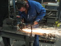 Micke cuts a sheet to the logging table on the wood hacker.