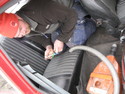 Micke vacuum-cleans the car for the inspection.