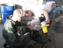 Martin and Micke mounting the new saw in the wood hacker.